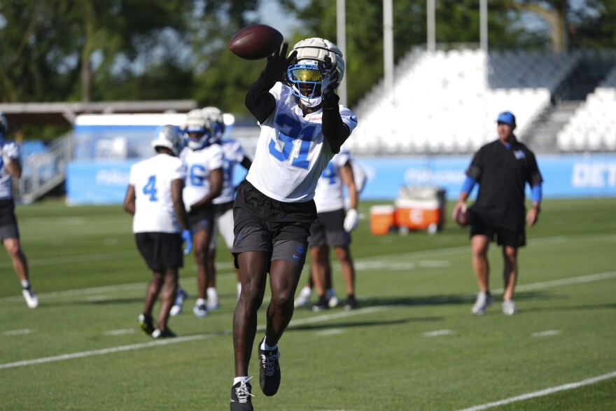 Detroit Lions safety Kerby Joseph (31) catches a ball during an NFL football practice in Allen Park, Mich., Tuesday, July 22, 2025. (AP Photo/Paul Sancya)