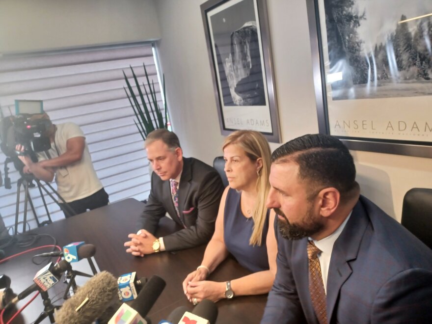 Enrique Tarrio's mother, Zuny Duarte, speaks to reporters at a press conference on Sept. 7. She is flanked by Tarrio's attorneys, Sabino Jauregui (left) and Nayib Hassan (right).