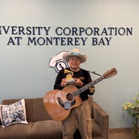 Kahumoku holding his Grammy at Ryan Ranch