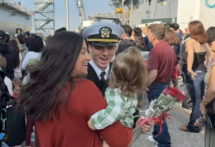 Families reunite at the homecoming for USS San Antonio.