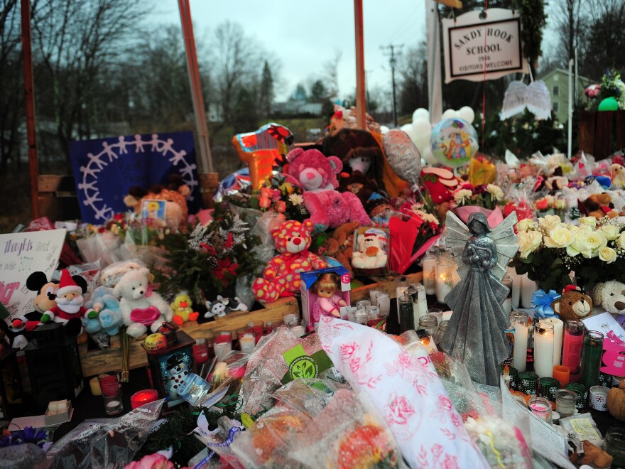 A makeshift shrine to the victims of the Sandy Hook Elementary school shooting is set up shortly after the massacre in December 2012 in Newtown, Conn.