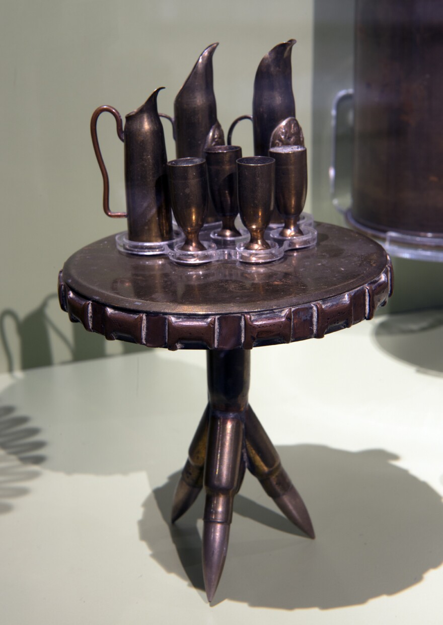 Soldiers made this miniature table, set for guests, out of casings and bullets.