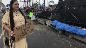 Renee Roman Ose, a descendent of the Oklahoma Cheyenne, came to the Oswego Harbor Saturday to protest the two Christopher Columbus ships and educate people on about the genocide and terror it brought to the original inhabitants of the Americas. (Payne Horning/WRVO)