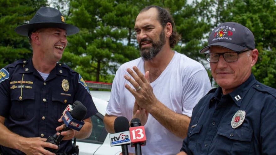 [L-R] Indiana State Police Sergeant John Perrine, retired NBA player Scot Pollard, and Wayne Township Fire Department Captain Mike Pruitt after getting out of the 112 degree car.