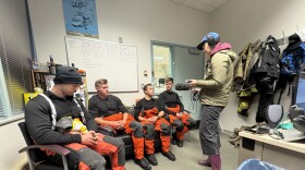 KYUK reporter Samantha Watson (right) interviews members of the U.S. Coast Guard in the wake of ex-Typhoon Halong. October 2025.