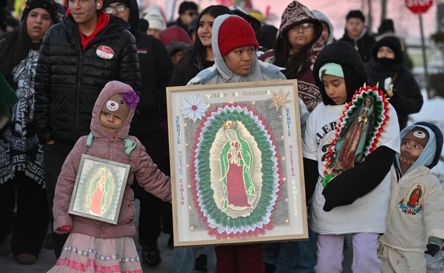 Many carried pictures and statues of Our Lady of Guadalupe during Friday's procession in Wilkes-Barre.