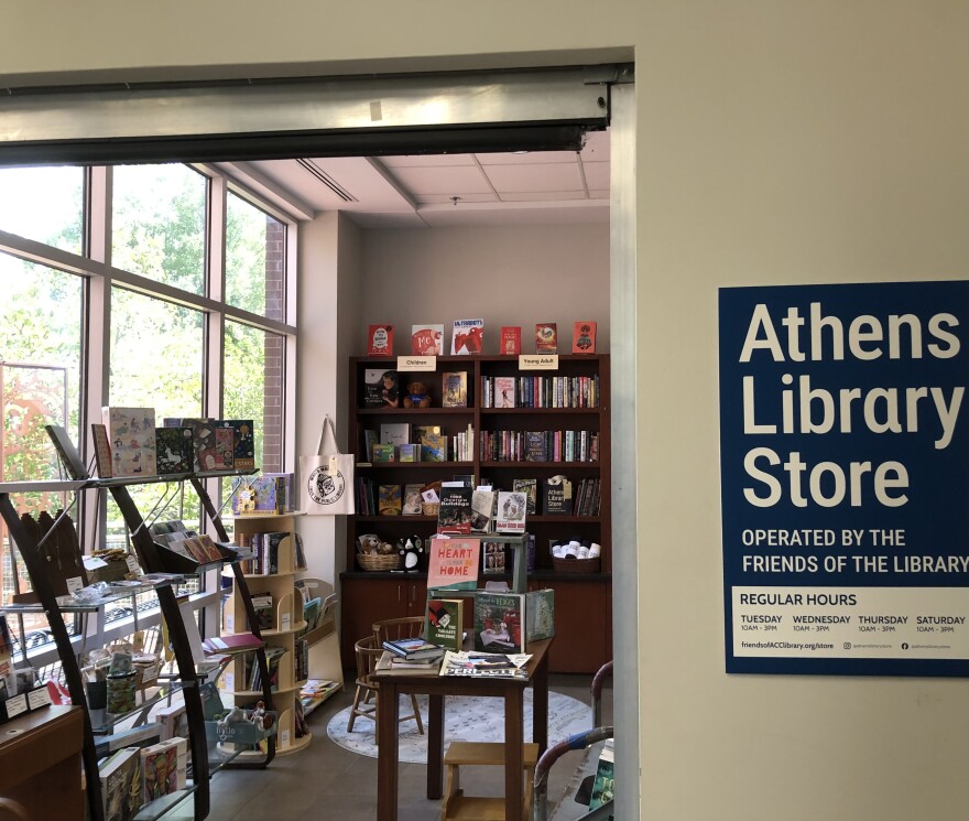 The doorway into a small shop filled with books.