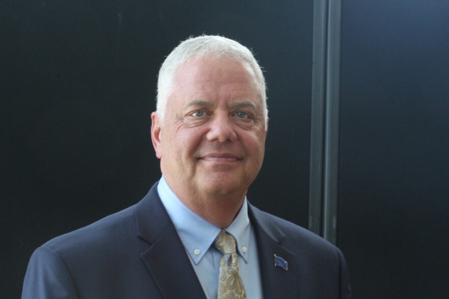 a portrait of a main in a suit