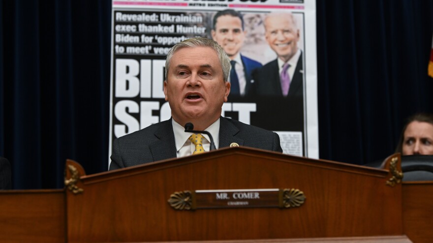 House Oversight Committee Chairman Rep. James Comer is seen in front of a newspaper page with a photograph of Hunter Biden and his father President Biden during a House Committee on Oversight and Accountability hearing on Feb. 8.