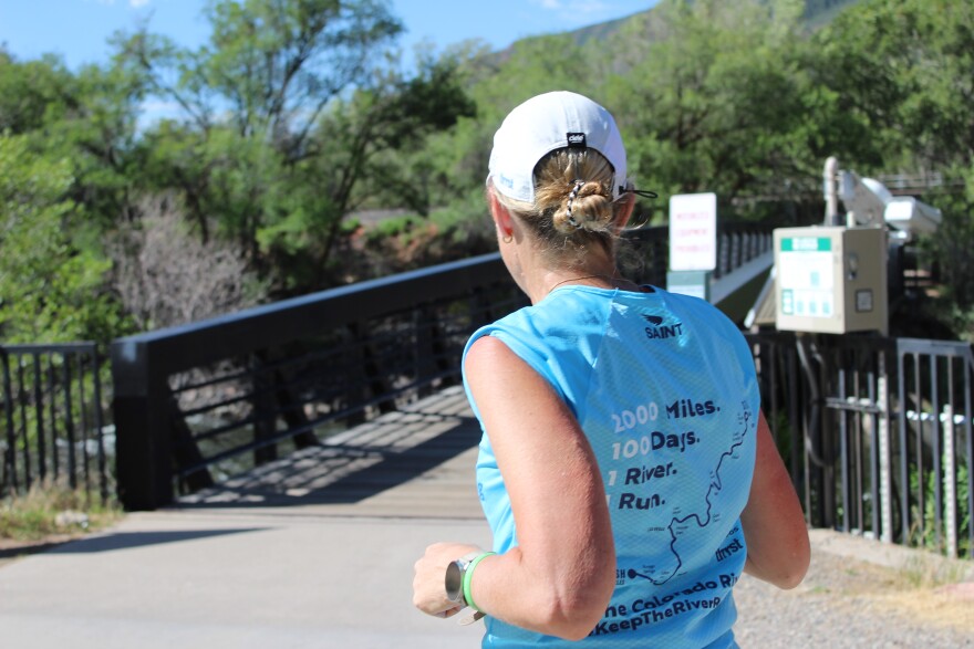 Mina Guli runs towards a bridge which crosses over the Colorado River during a run in Glenwood Springs on June 27, 2026.
