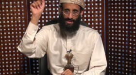 In this image taken from video and released by SITE Intelligence Group, Anwar al-Awlaki speaks in a video message posted on radical websites in November, 2010.