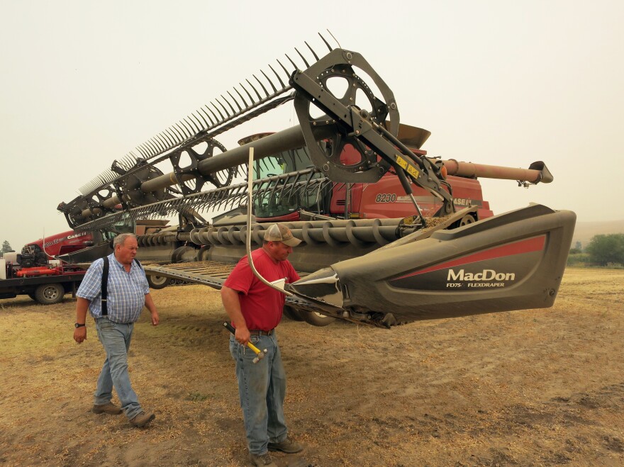Chad (right) and Lee Heimgartner harvest chickpeas near Kendrick, Idaho. Until this past spring, farmers along the Washington-Idaho border shipped beans and peas in containers to the Port of Portland.