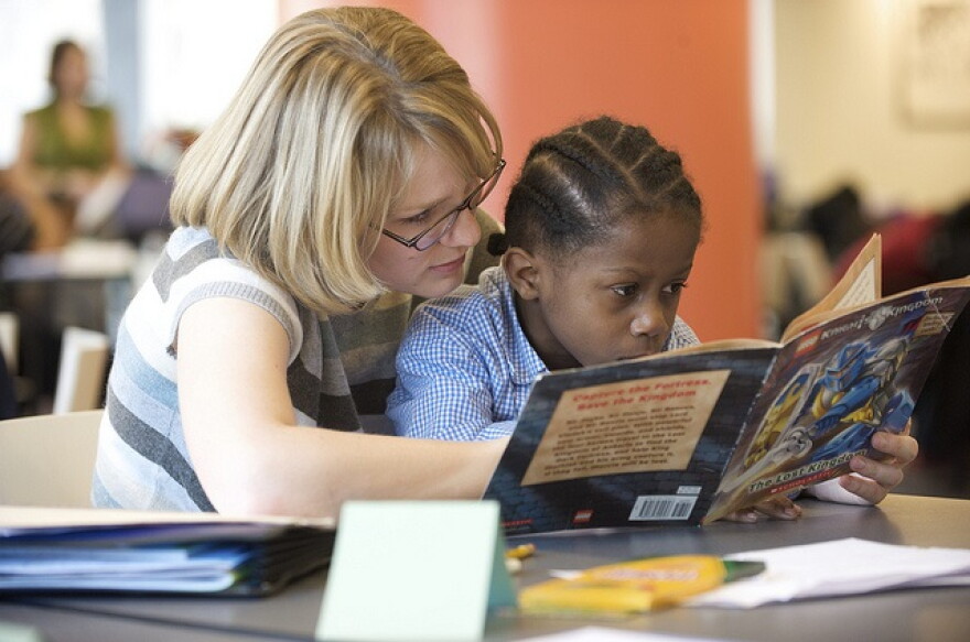 A teacher reads to her student. (UNDATED PHOTO).