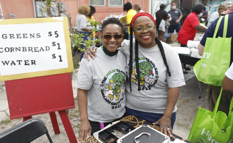 Shavon Gonzalez and Andrida Hosey pose for a photo during the 2022 Publix Tampa Bay Collard Festival in St. Petersburg, Florida, on Saturday, February 19, 2022. Photo by Octavio Jones for WUSF