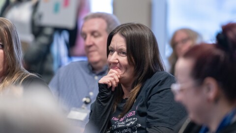 Erika Shambaugh and other audience members listen during a “Voices of the Epidemic” forum hosted by Spotlight PA in April 2025 in Berks County.