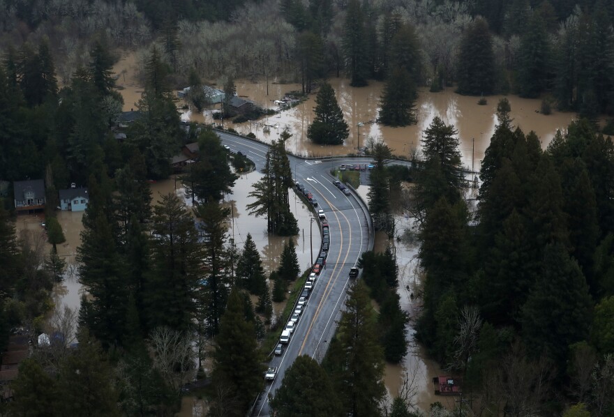 State Route 116 cuts through a flooded neighborhood in Guerneville.