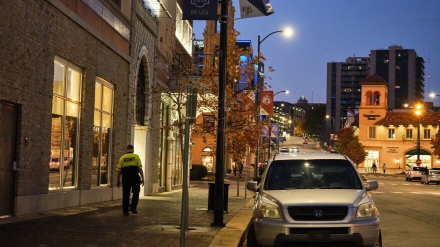 A lone security guard, part of The Country Club Plaza's private crew, can often be seen walking in the area. The neon portion of the guard's uniform alerts shoppers.