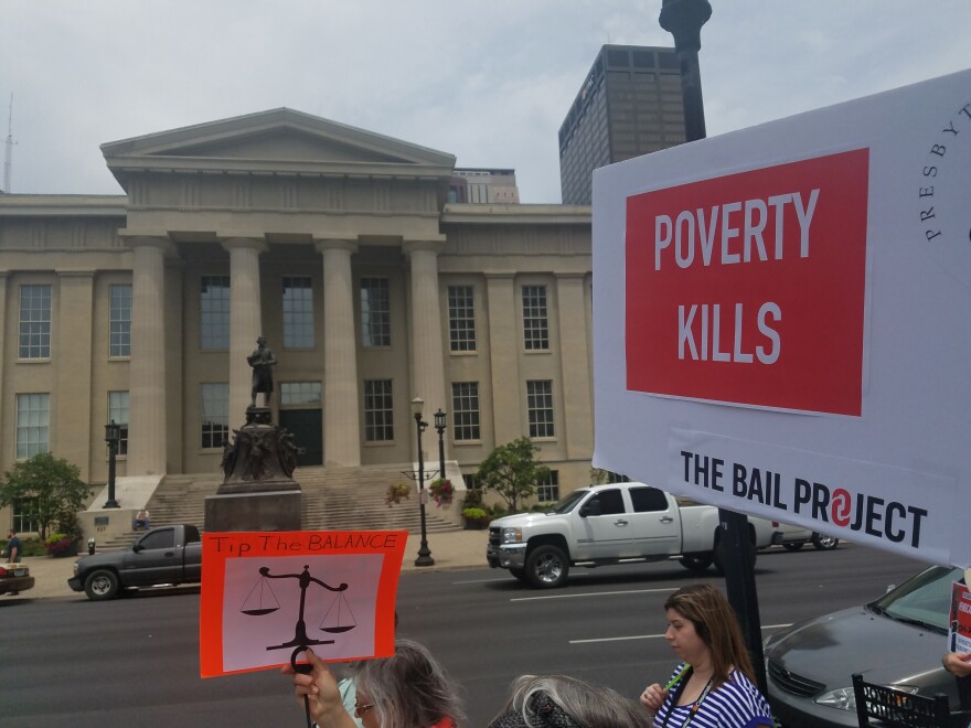More than a hundred protesters marched downtown against cash bail