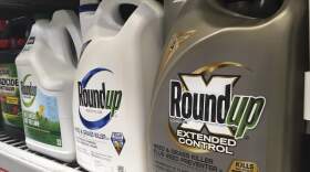 Containers of Roundup sit on a store shelf. (Haven Daley/AP)