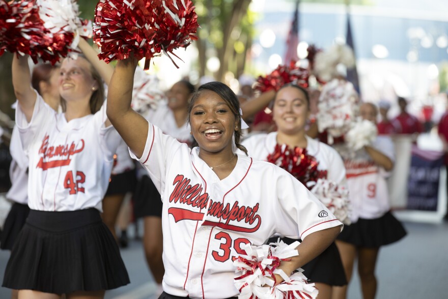 The Little League World Series parade included Williamsport Area High School cheerleaders and the marching band.