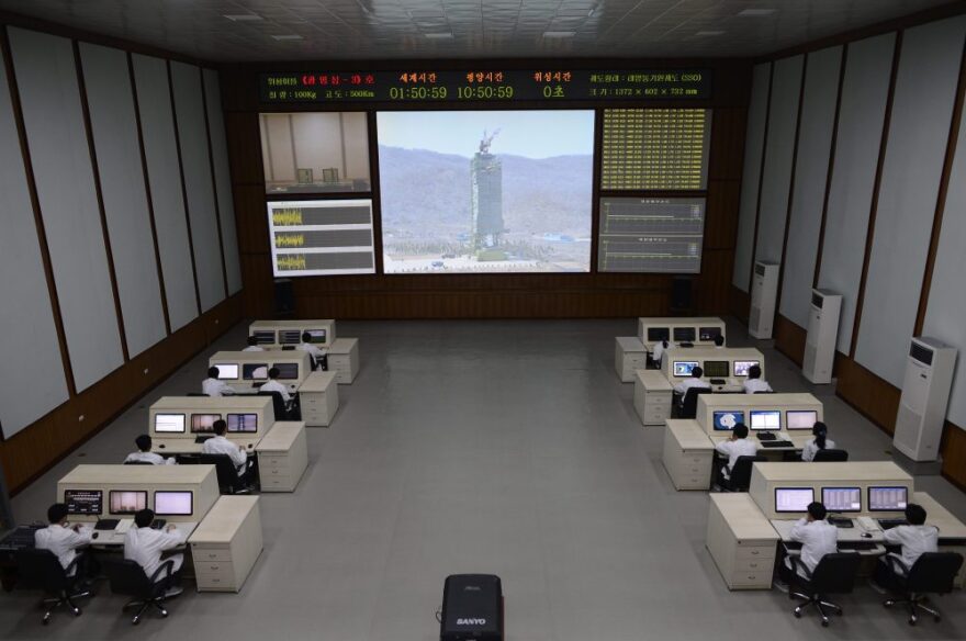 North Korean technicians watch live images of the rocket Unah-3 at the satellite control room of the space center on the outskirts of Pyongyang on Wednesday.