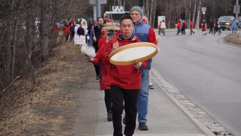Michael Ulroan and other members of the Qissunamiut Yurartet Dancers of Chevak lead participants in a walk along Providence Drive in the University of Alaska Anchorage campus on April 30, 2026, to call attention to Indigenous crime victims. They were participating in the third annual Walk for Missing and Murdered Indigenous People hosted held at UAA and hosted by the Alaska Native Science and Engineering Program.