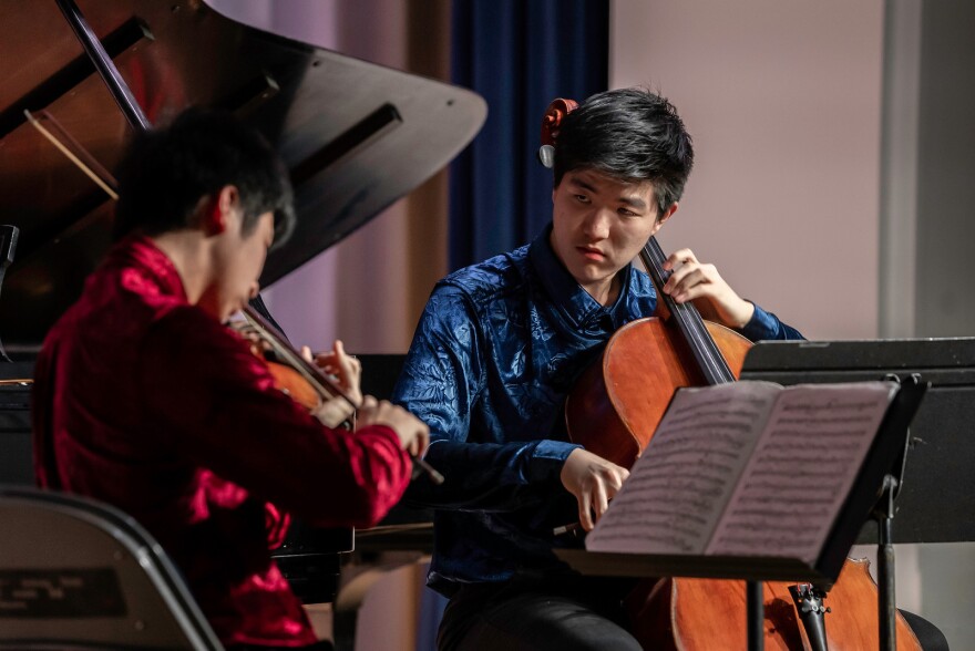 Cellist Samuel Cao performing as a member of the Myer Schwartz Piano Trio at a Settlement Music School Advanced Study concert.