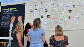 The outside of the Trump-Epstein Bookmobile shows a timeline of Trump, Epstein, and their relationship shown in documents from the Epstein files.