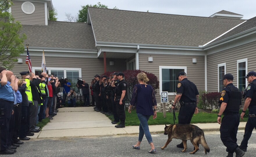 Ciro, a retired police dog, is led into the Pittsfield Veterinary Hospital for his last call.