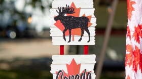 Signage at the 2025 Canadiana Festival depicting a moose and the phrase "Oh, Canada"