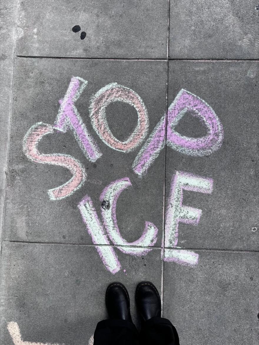 Chalk drawing of the words, “Stop ICE”, on the sidewalk, in front of SF immigration court.