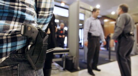 A concealed handgun permit holder waits to enter the General Assembly building in Richmond, Va., on Jan. 21. Known as "gun lobby day," crowds of gun owners visited the capital to argue in favor of gun rights. Most states in the U.S. allow people to openly carry guns in certain public places.