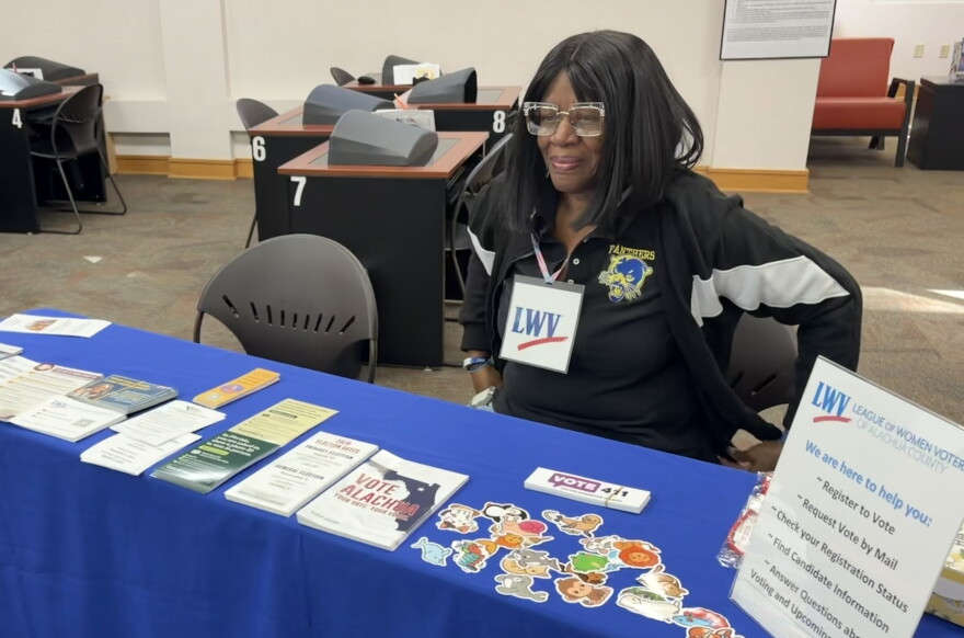 Alena Lawson Bennett tabled for the League of Women Voters at the Newberry Branch Library on Oct. 20, 2026. (Anna O’Neill/WUFT News)