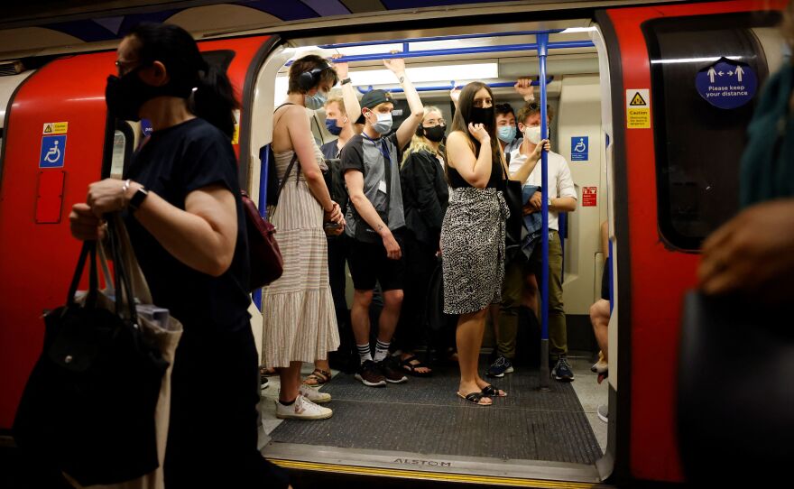 Commuters on the London Underground continued to wear masks on Monday, as required by the transport service.