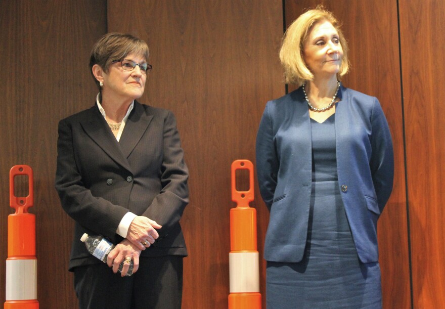 Gov. Laura Kelly with Transportation Secretary Julie Lorenz at a news conference announcing plans to resume at set of unfinished highway projects. 