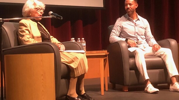 Carla Peperzak speaks to Ferris High School students with Andre Wicks, the principal of Spokane's Peperzak Middle School, in 2022.