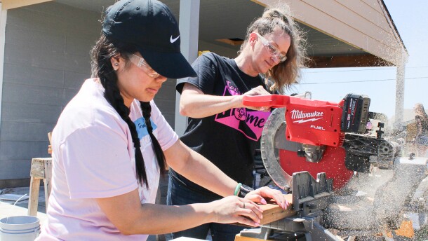 Trang Nguyễn and Lisa Mayfield, who are realtors with Berkshire Hathaway, work on a house on Piatt Street for Habitat Women Build. After Habitat is done with these homes, it will start on the Pope Leo Village.