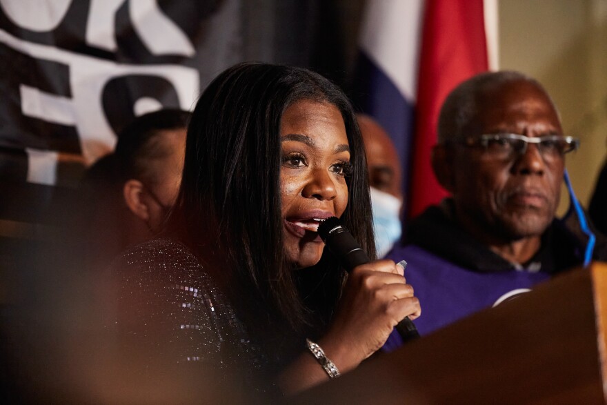 Cori Bush addresses supporters though tears Tuesday night, after the defeating her 1st Congressional District opponents. Bush will be the first Black woman to represent Missouri in Congress. 