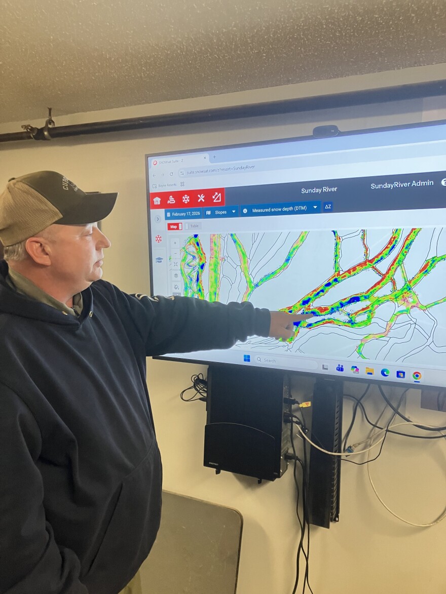 Nathan Brown - "Brownie" - Sunday River's grooming manager points out a color-coded map of snow depth on the resort's trails generated by grooming machines.