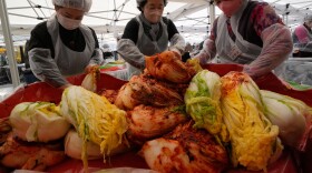 Buddhists make kimchi, a traditional pungent vegetable dish, to donate to needy neighbors, at Jogye temple in Seoul, South Korea, Sunday, Nov. 16, 2025.