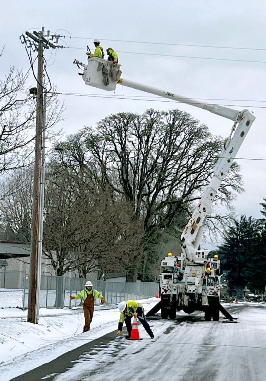 Utility workers in Southwest Portland on Sunday, Jan. 14, 2024.