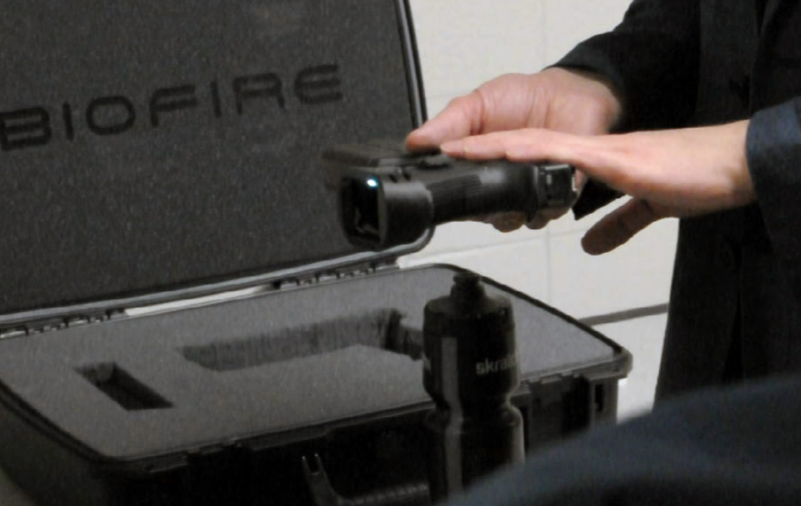 Inventor Kai Kloepfer displays his fingerprint-activated smart gun during a gun safety technology expo in Milwaukee on Jan. 16, 2019.