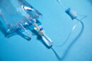 This stock photo shows an IV bag on a blue background.