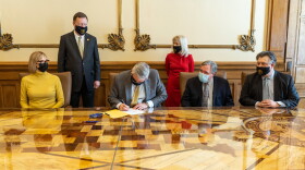 Gov. Eric Holcomb signed Senate Bill 1 into law Thursday. It will give businesses, schools, health care providers and others protections from COVID-19 civil lawsuits.