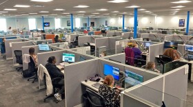 In this file photo, workers at a Medicaid call center in Jefferson City, Mo., field questions and review information regarding eligibility determinations on Aug. 16, 2023.