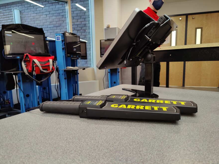 Handheld scanners on a security table at Binghamton High School. (Megan Zerez/WSKG)