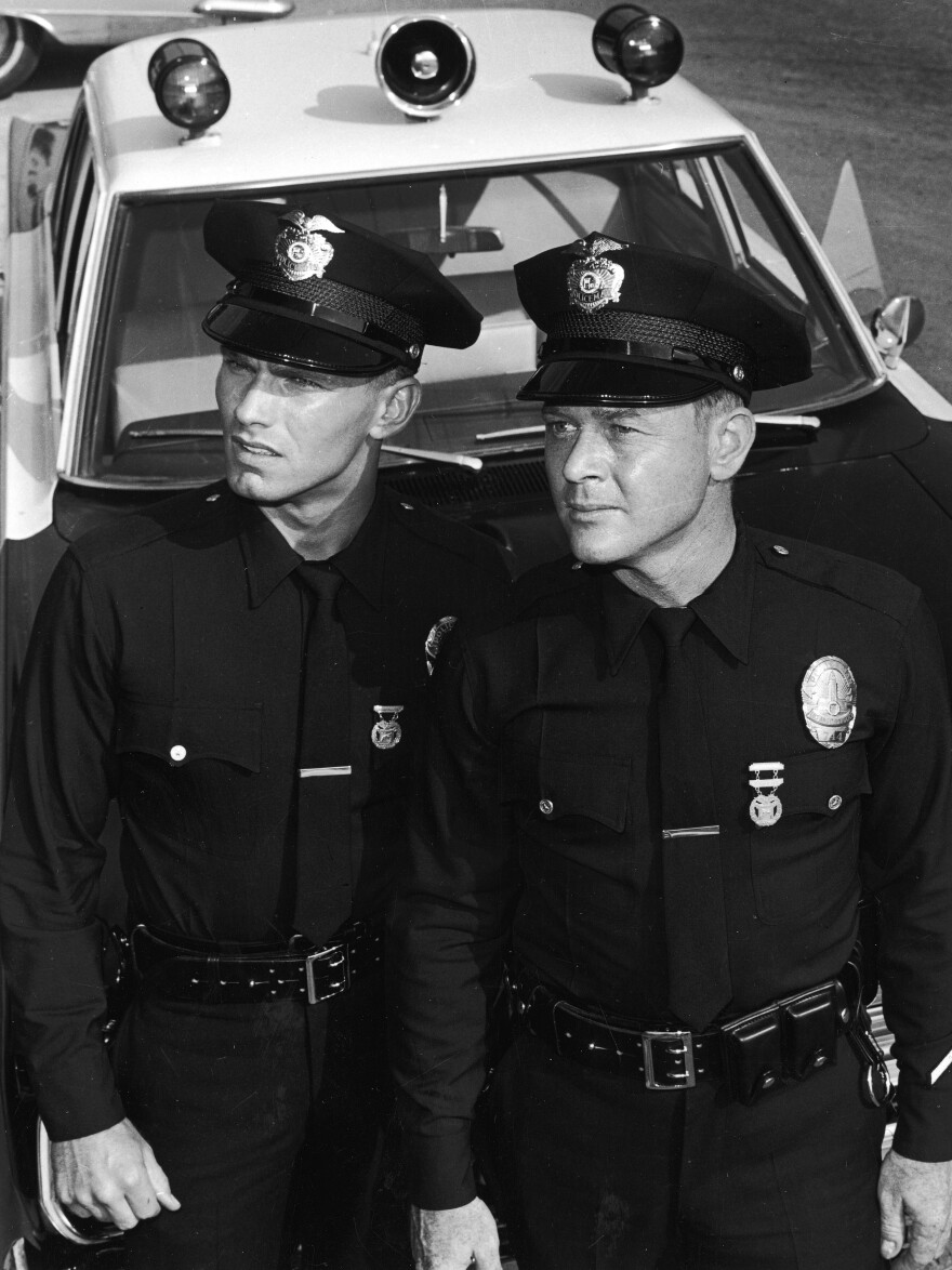 Martin Milner (right) died Sunday at age 83. He's seen here with co-star Kent McCord on the set of their TV series <em>Adam-12</em> in 1969.