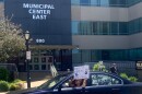 A car in a Black Lives Matter parade passes in front of Springfield Police Department headquarters on Monroe Street. 