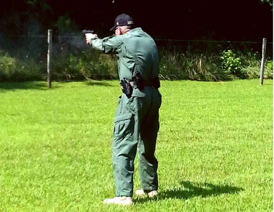 Rockingham County Sheriff Sam Page takes aim at a steel plate during a round of target practice earlier this month. Mayodan, a small town in the county, is the site of a new gun manufacturing plant that will create more than 450 jobs.