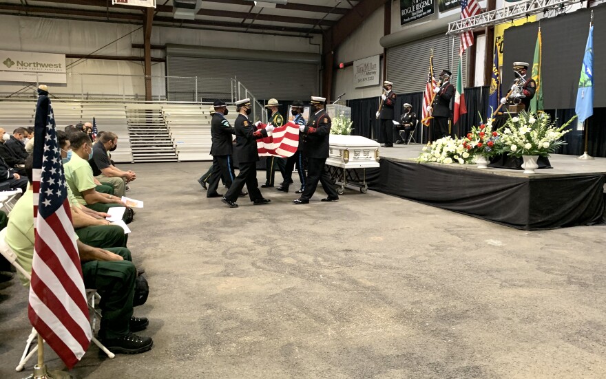 A flag ceremony at the memorial for Frumencio Ruiz Carapia. He was killed while fighting the Gales Fire on August 23, 2021.